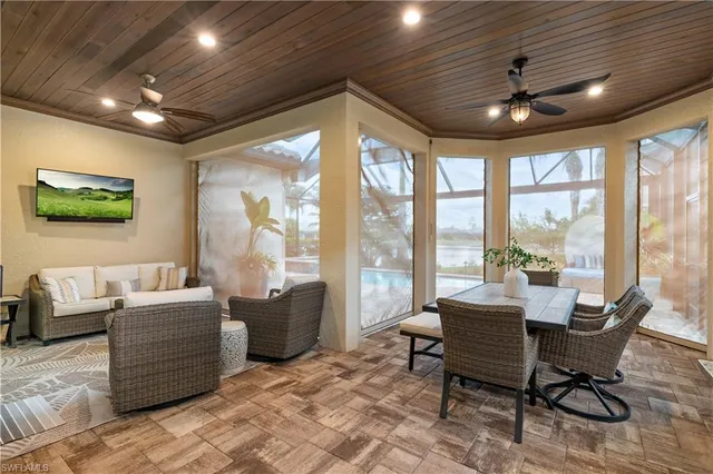 a view of a house with backyard porch and sitting area