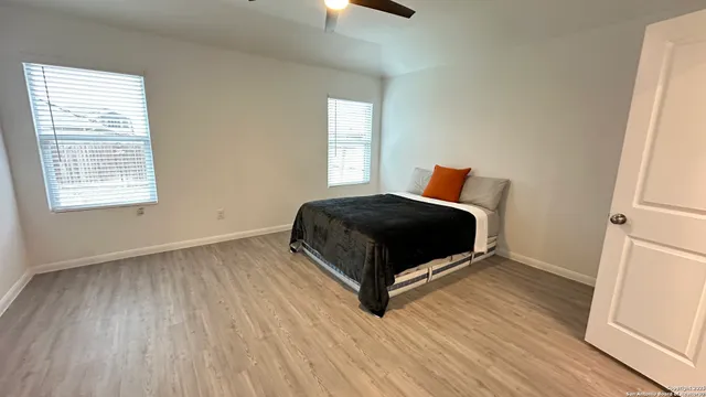 a room with a bed and window