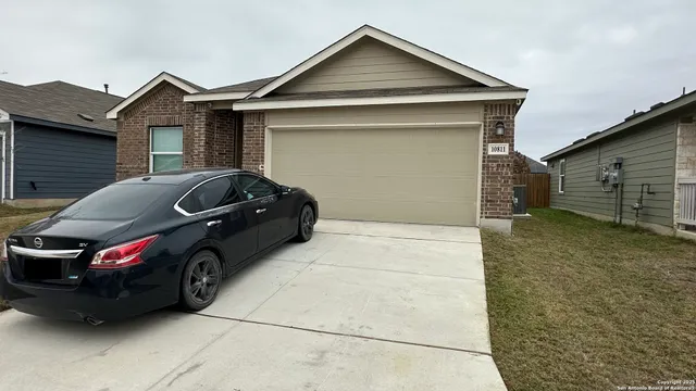 a car parked in front of a house