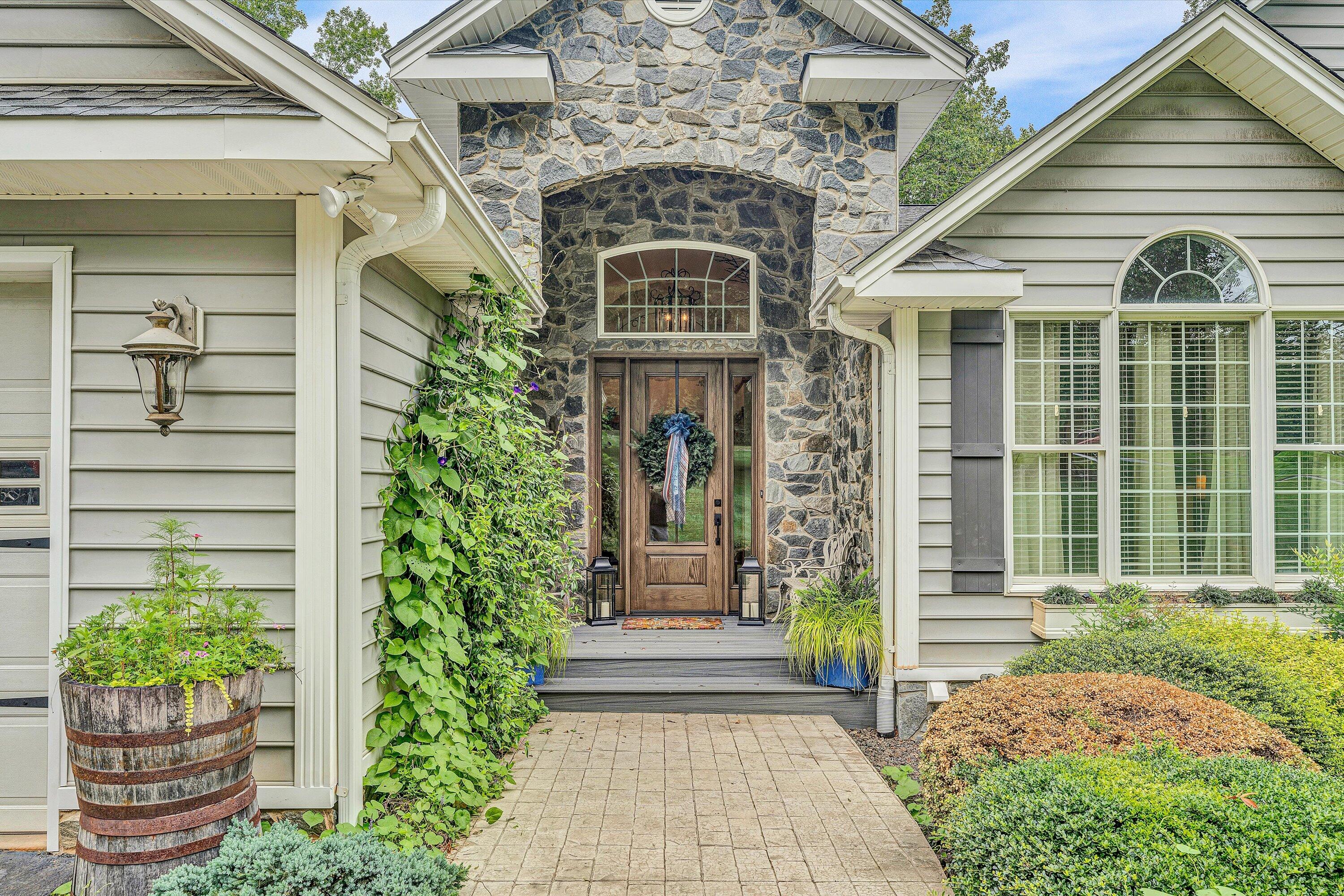 239 Cedar Bay Road Union Hall, VA 24176 - Photo 5 of 51 a front view of a house with garden