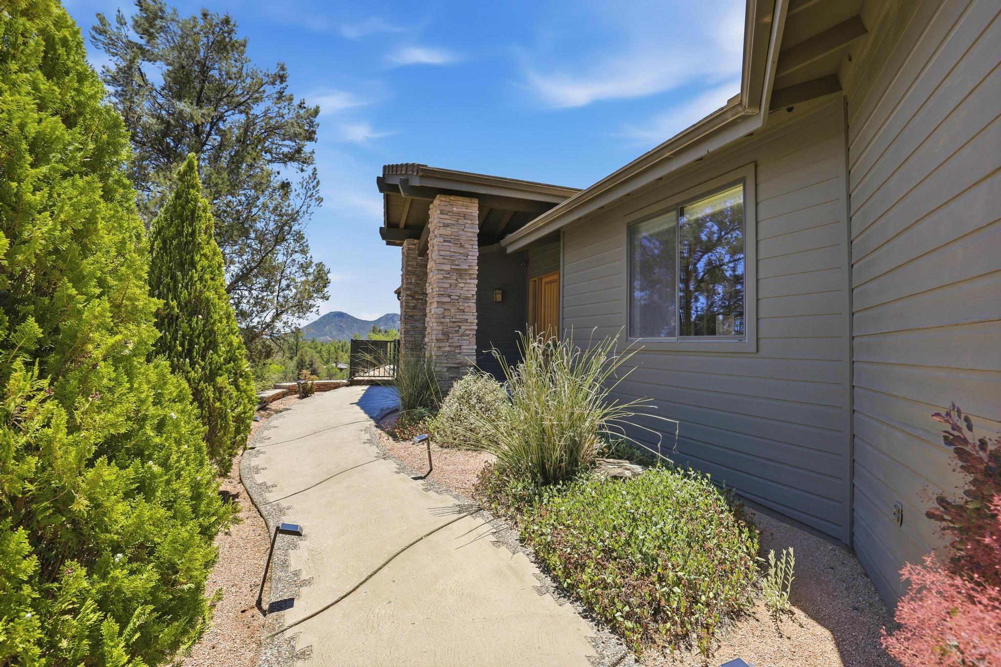 2908 East Rim Club Drive Payson, AZ 85541 - Photo 5 of 77 a couple of flower plants in front of door