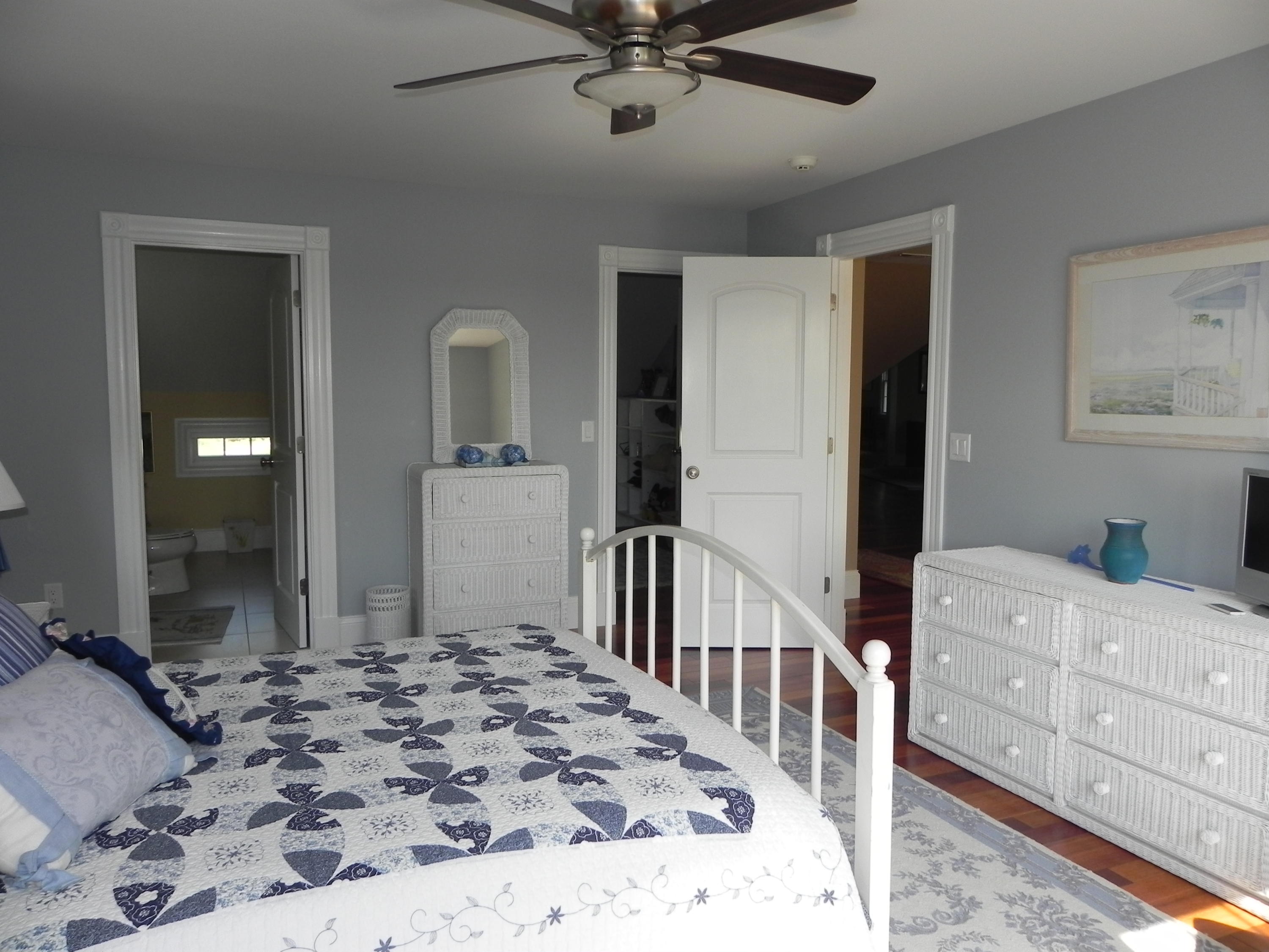 160 Bay Road Cotuit, MA 02635 - Photo 14 of 31 a bedroom with a bed dresser and a window