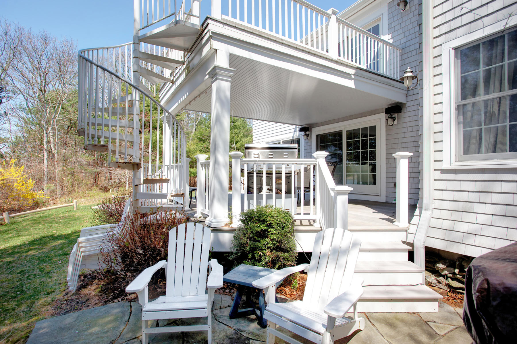 160 Bay Road Cotuit, MA 02635 - Photo 26 of 31 a view of a patio with table and chairs and potted plants