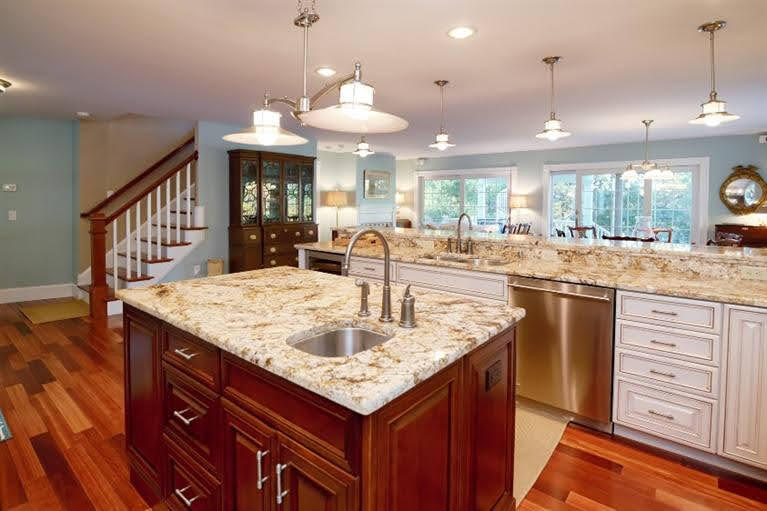 160 Bay Road Cotuit, MA 02635 - Photo 8 of 31 a kitchen with center island table and chairs