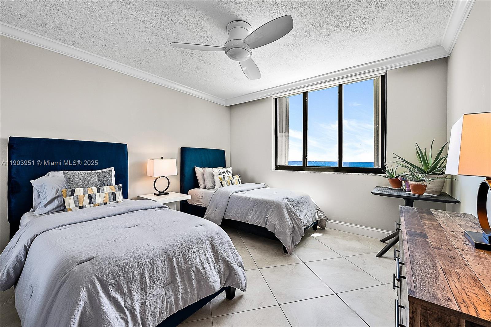 400 Ocean Trail Way, Unit 1005 Jupiter, FL 33477 - Photo 14 of 23 a bedroom with two beds and a large window