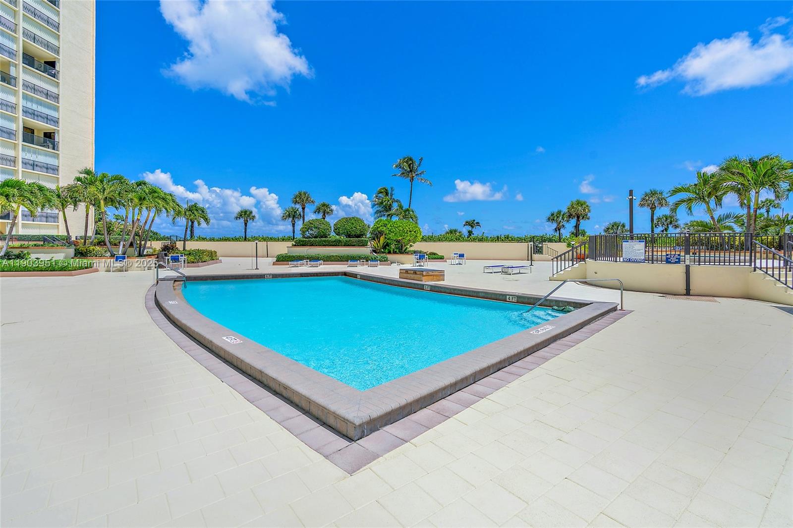 400 Ocean Trail Way, Unit 1005 Jupiter, FL 33477 - Photo 18 of 23 a view of a pool with outdoor seating and city view