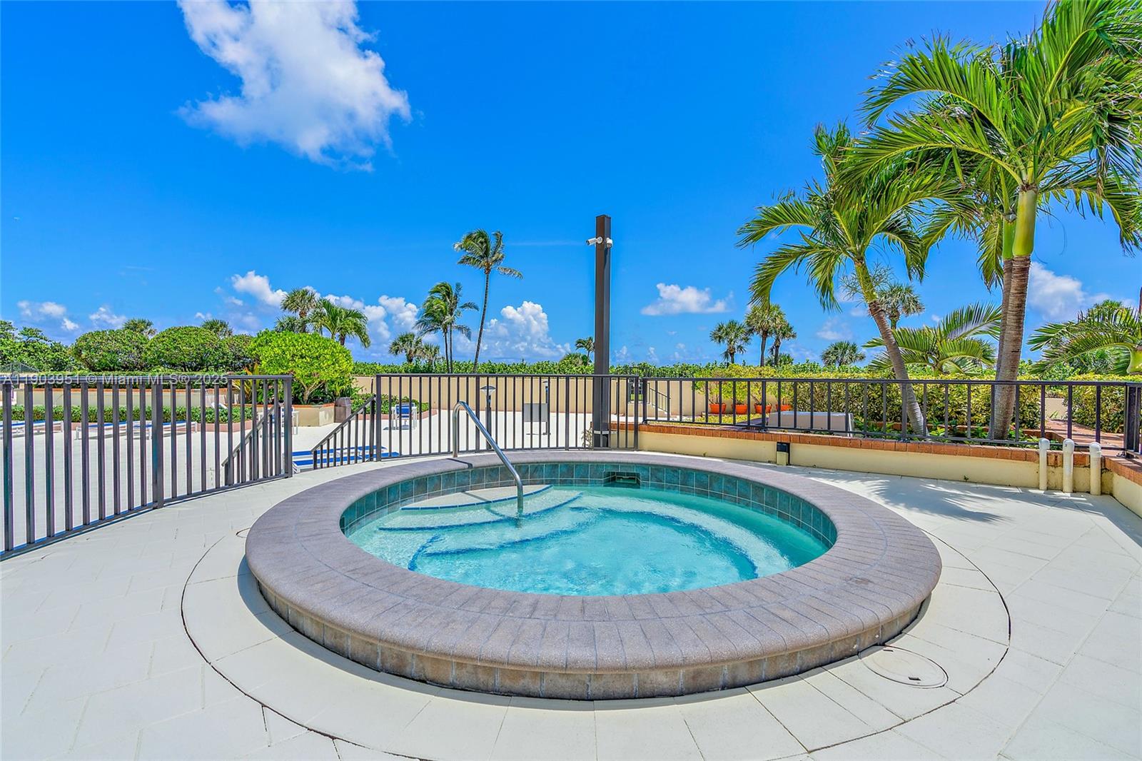 400 Ocean Trail Way, Unit 1005 Jupiter, FL 33477 - Photo 19 of 23 a view of a swimming pool with a lounge chair