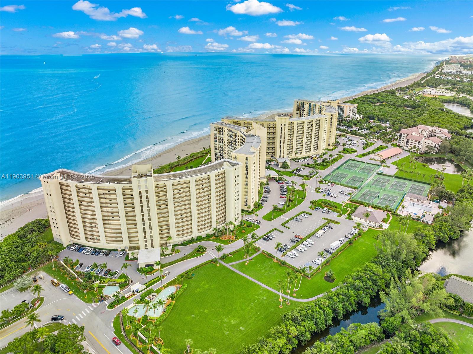 400 Ocean Trail Way, Unit 1005 Jupiter, FL 33477 - Photo 21 of 23 a front view of a house with a garden