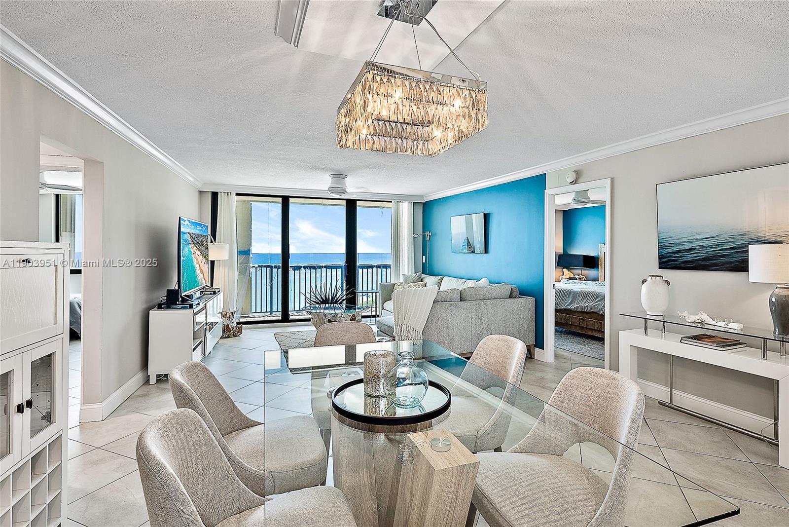400 Ocean Trail Way, Unit 1005 Jupiter, FL 33477 - Photo 6 of 23 a view of a dining room with furniture wooden floor and chandelier