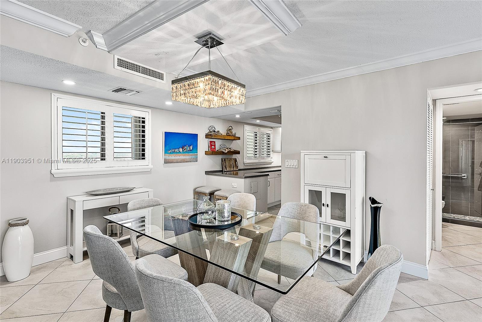 400 Ocean Trail Way, Unit 1005 Jupiter, FL 33477 - Photo 9 of 23 a living room with furniture and a large window