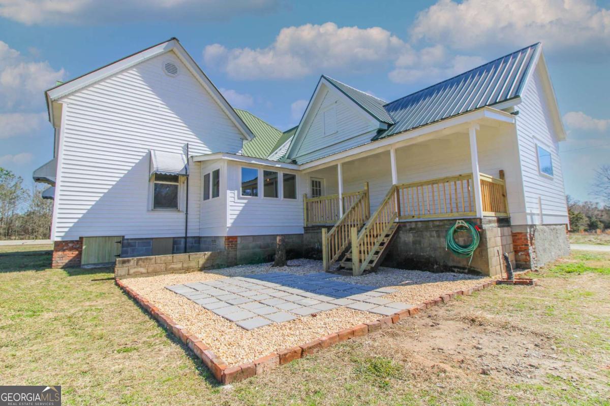 1782 Union Point Road Stephens, GA 30667 - Photo 1 of 1 a view of a house with a snow in the yard