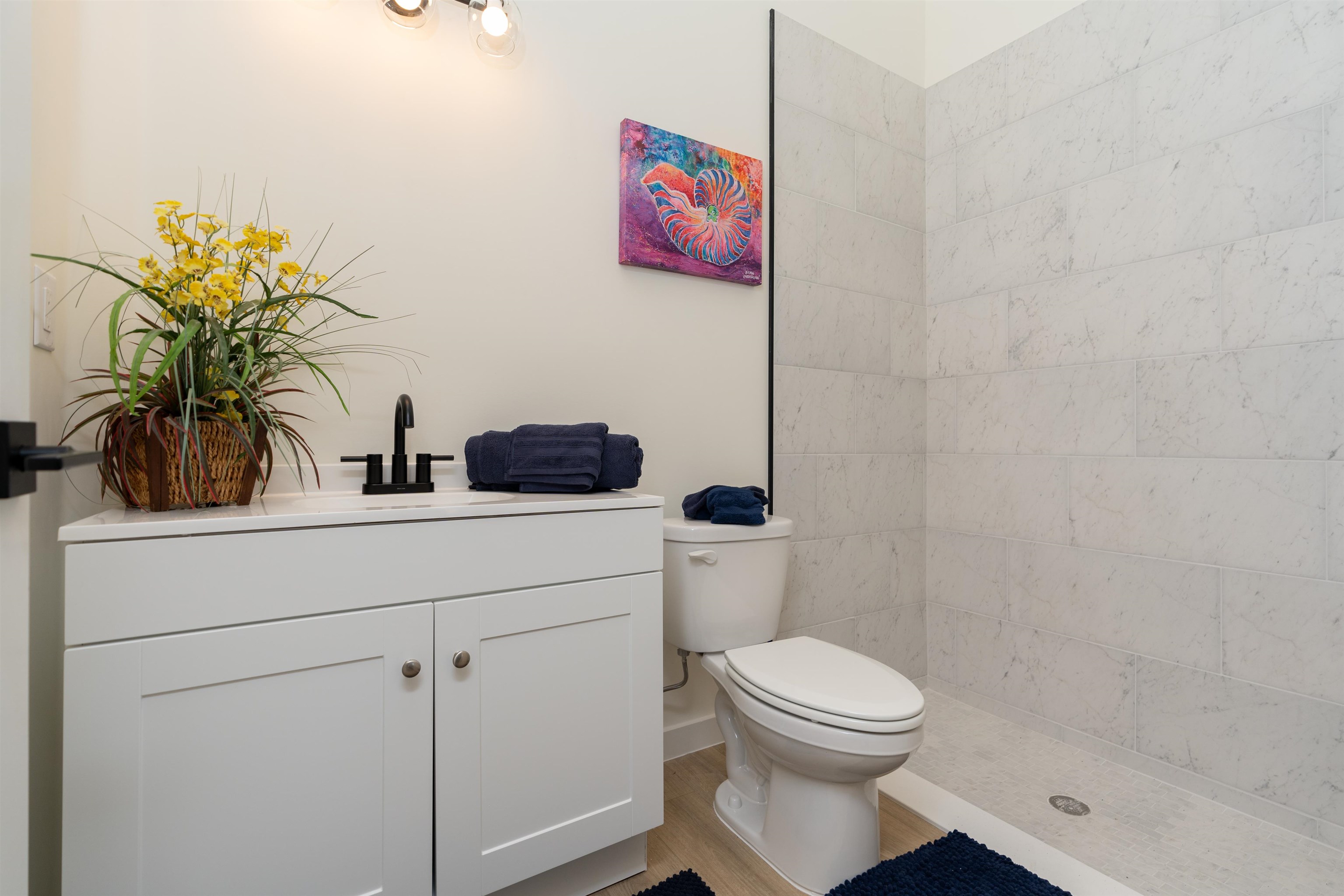 816 West 9th Street St. Augustine, FL 32084 - Photo 16 of 28 a bathroom with a toilet sink and shower