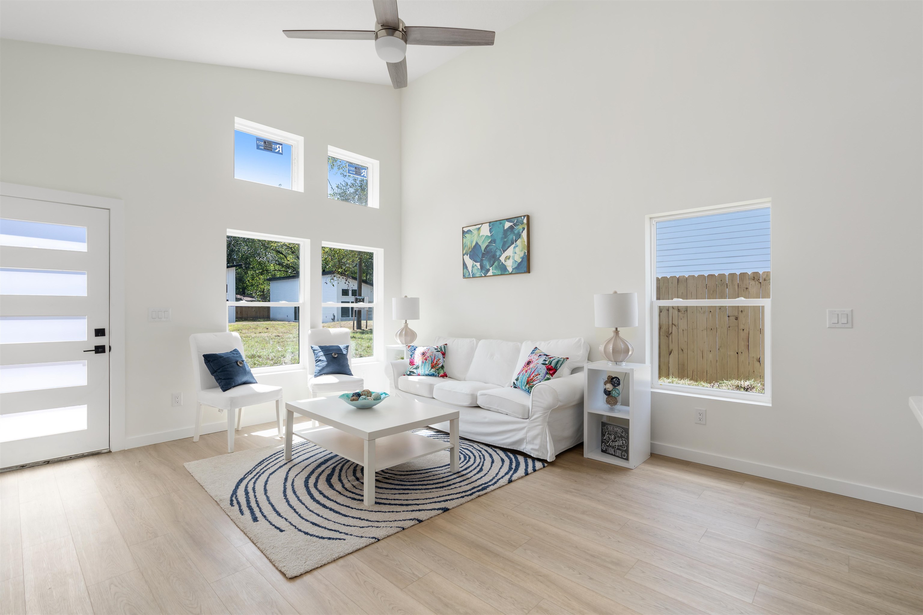 816 West 9th Street St. Augustine, FL 32084 - Photo 3 of 28 a living room with furniture two window and a wooden floor
