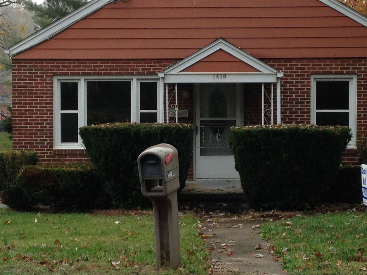 1418 Spring Hill Road Staunton, VA 24401 - Photo 1 of 18 a front view of a house with garden