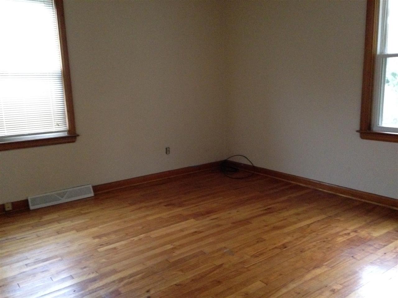 1418 Spring Hill Road Staunton, VA 24401 - Photo 11 of 18 an empty room with wooden floor and windows