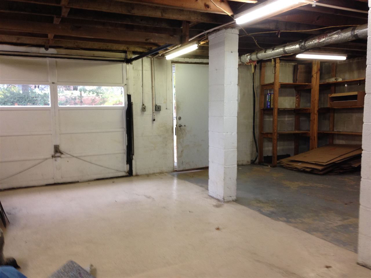 1418 Spring Hill Road Staunton, VA 24401 - Photo 16 of 18 a view of an empty room with wooden shelves