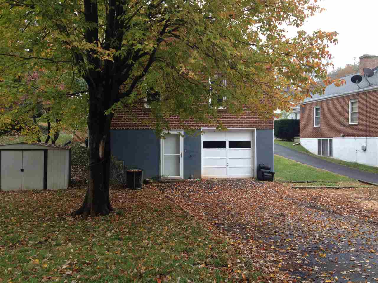 1418 Spring Hill Road Staunton, VA 24401 - Photo 17 of 18 a front view of a house with a yard and garage