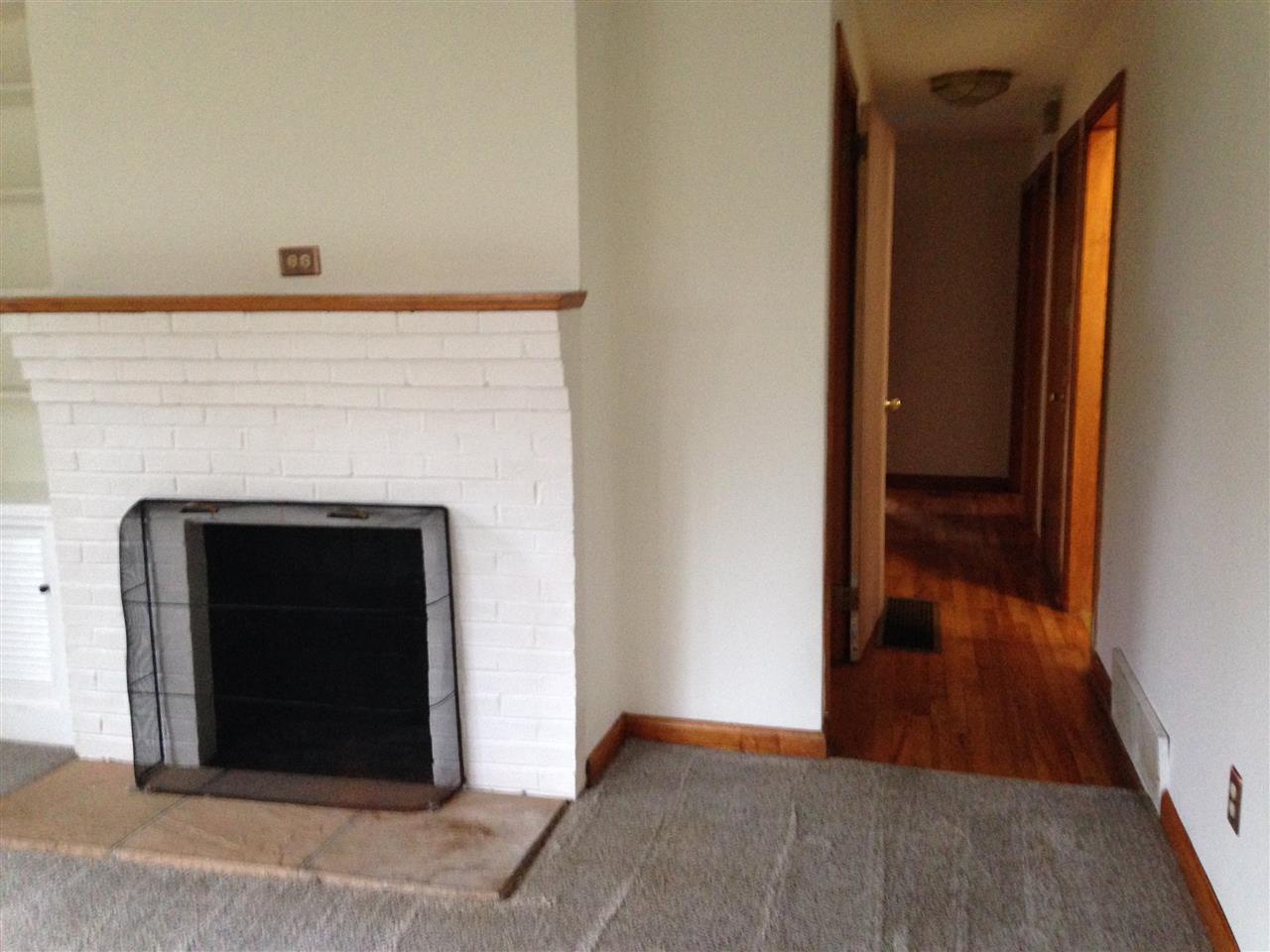 1418 Spring Hill Road Staunton, VA 24401 - Photo 5 of 18 a view of a livingroom with wooden floor and a fireplace