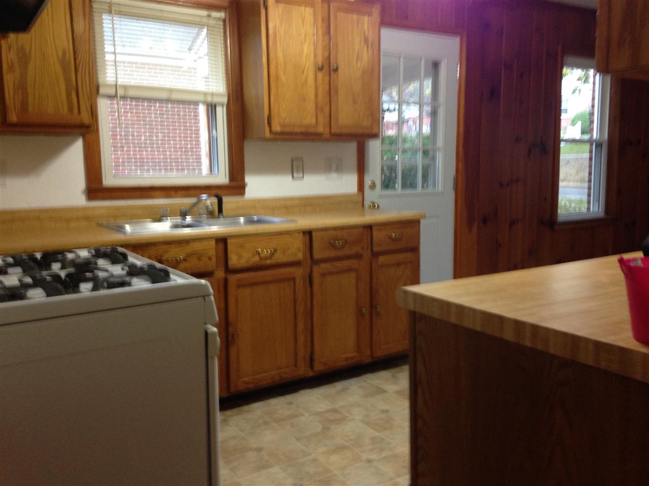 1418 Spring Hill Road Staunton, VA 24401 - Photo 8 of 18 a kitchen with a stove a sink and a refrigerator