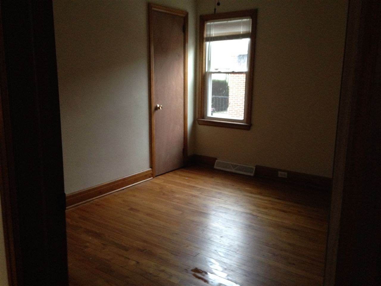 1418 Spring Hill Road Staunton, VA 24401 - Photo 10 of 18 a view of an empty room with wooden floor and a window