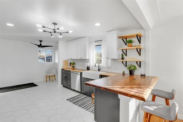 a kitchen with a cabinets counter top space and stainless steel appliances