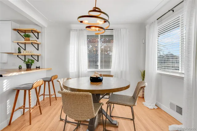 a dining room with furniture and window