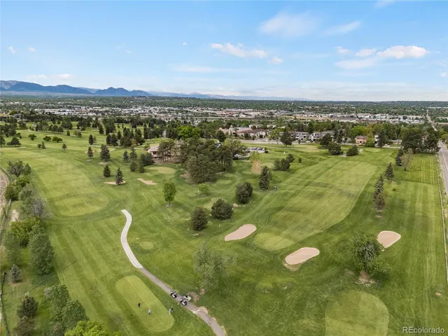 a view of residential houses with outdoor space and ocean view