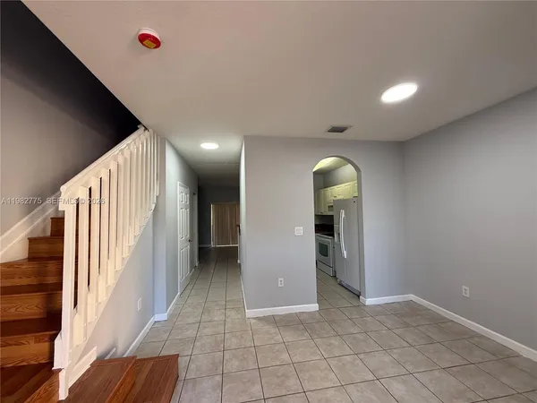 a view of entryway with hallway and wooden floor