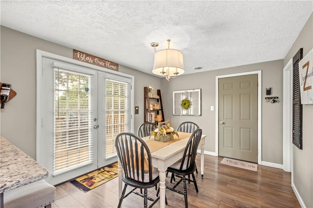 133 Baker Rd Extension Monaca, PA 15061 - Photo 13 of 25 a view of a dining room with furniture window and wooden floor