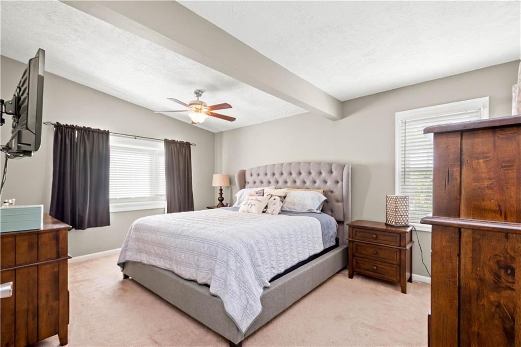 133 Baker Rd Extension Monaca, PA 15061 - Photo 14 of 25 a bedroom with a bed and a dresser