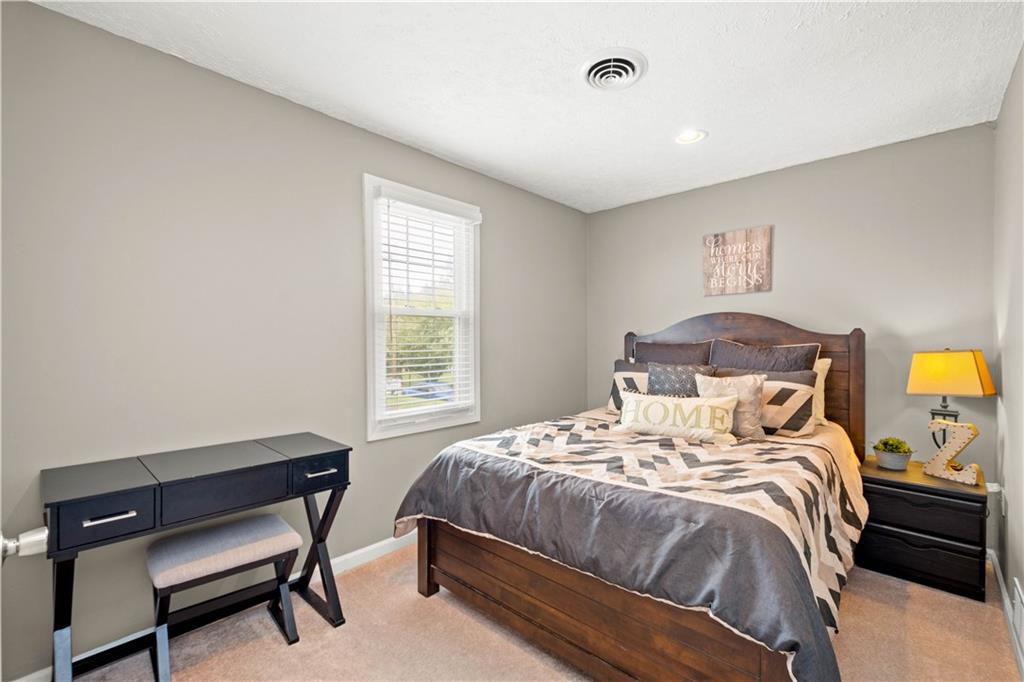 133 Baker Rd Extension Monaca, PA 15061 - Photo 17 of 25 a bedroom with a bed and a window