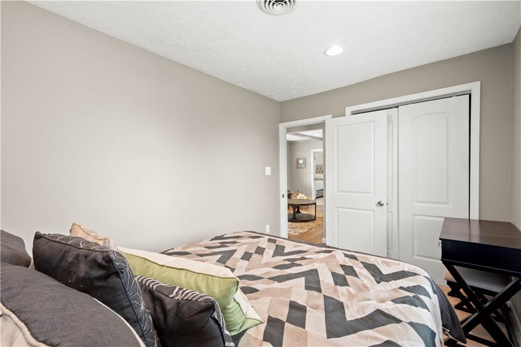 133 Baker Rd Extension Monaca, PA 15061 - Photo 18 of 25 a bedroom with a bed and a dresser