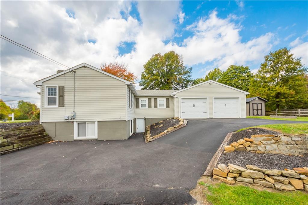 133 Baker Rd Extension Monaca, PA 15061 - Photo 3 of 25 a view of a house with a backyard