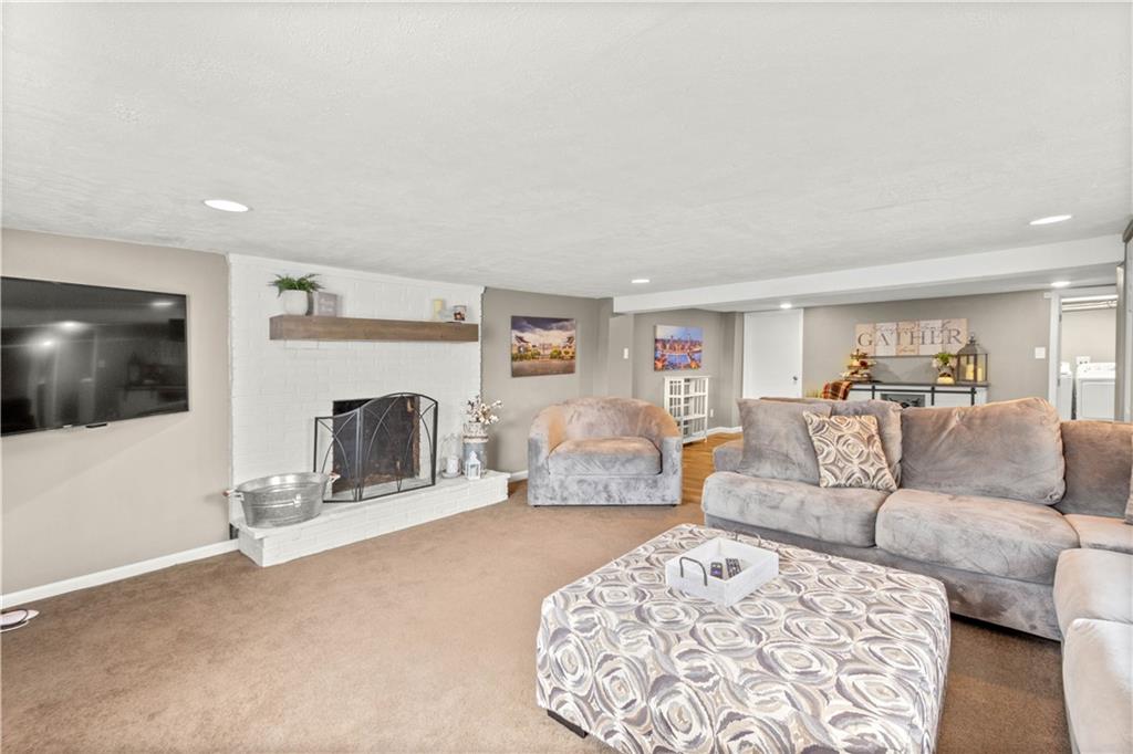 133 Baker Rd Extension Monaca, PA 15061 - Photo 23 of 25 a living room with furniture and a flat screen tv