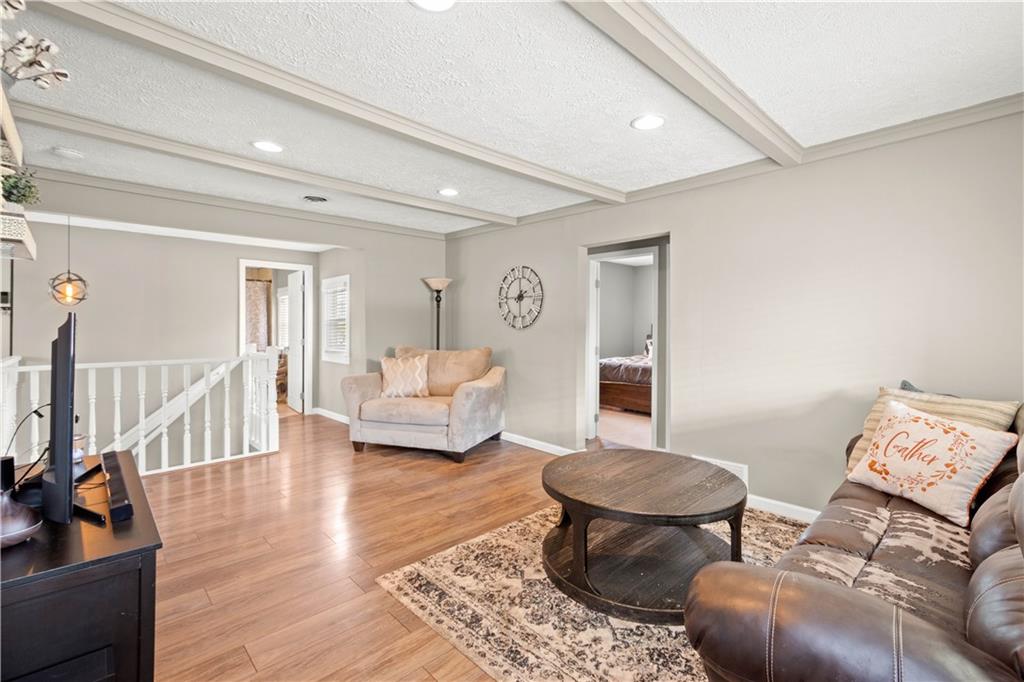 133 Baker Rd Extension Monaca, PA 15061 - Photo 6 of 25 a living room with furniture and a wooden floor