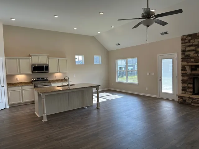 a kitchen with a stove and a refrigerator