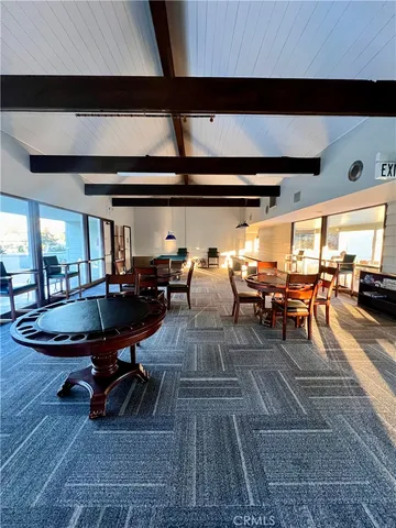 a room with lots of furniture and view of wooden floor