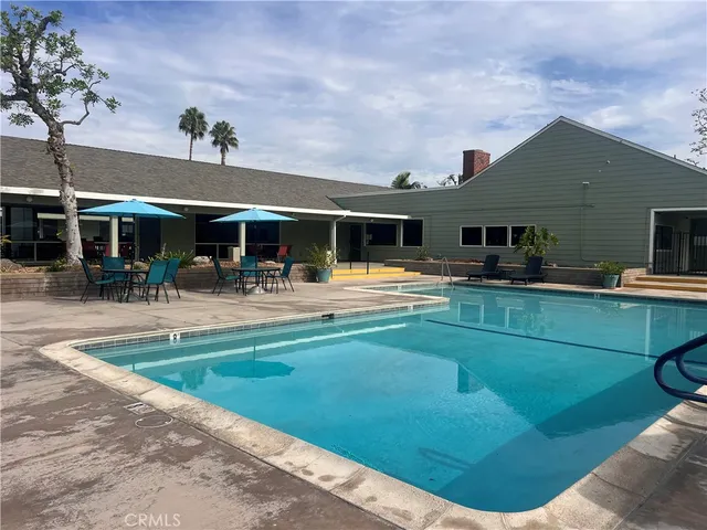 a view of a swimming pool with a patio
