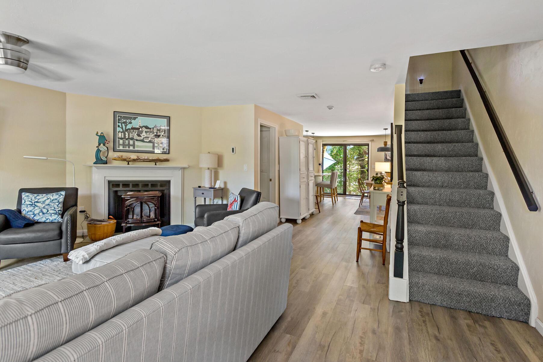 195 Falmouth Road, Unit 16A Mashpee, MA 02649 - Photo 17 of 43 a living room with furniture and a fireplace