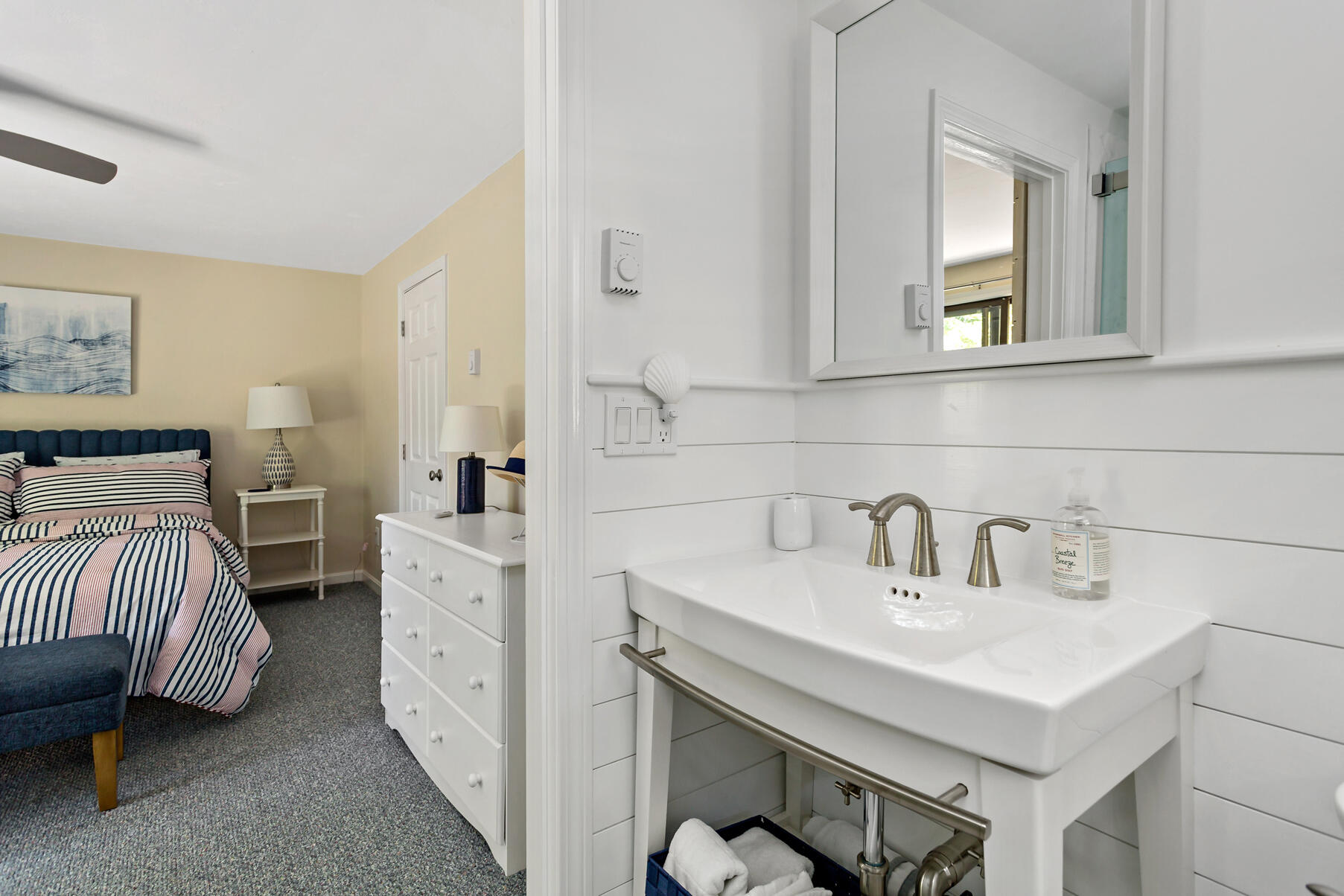 195 Falmouth Road, Unit 16A Mashpee, MA 02649 - Photo 27 of 43 a en suite bathroom with a sink and a mirror