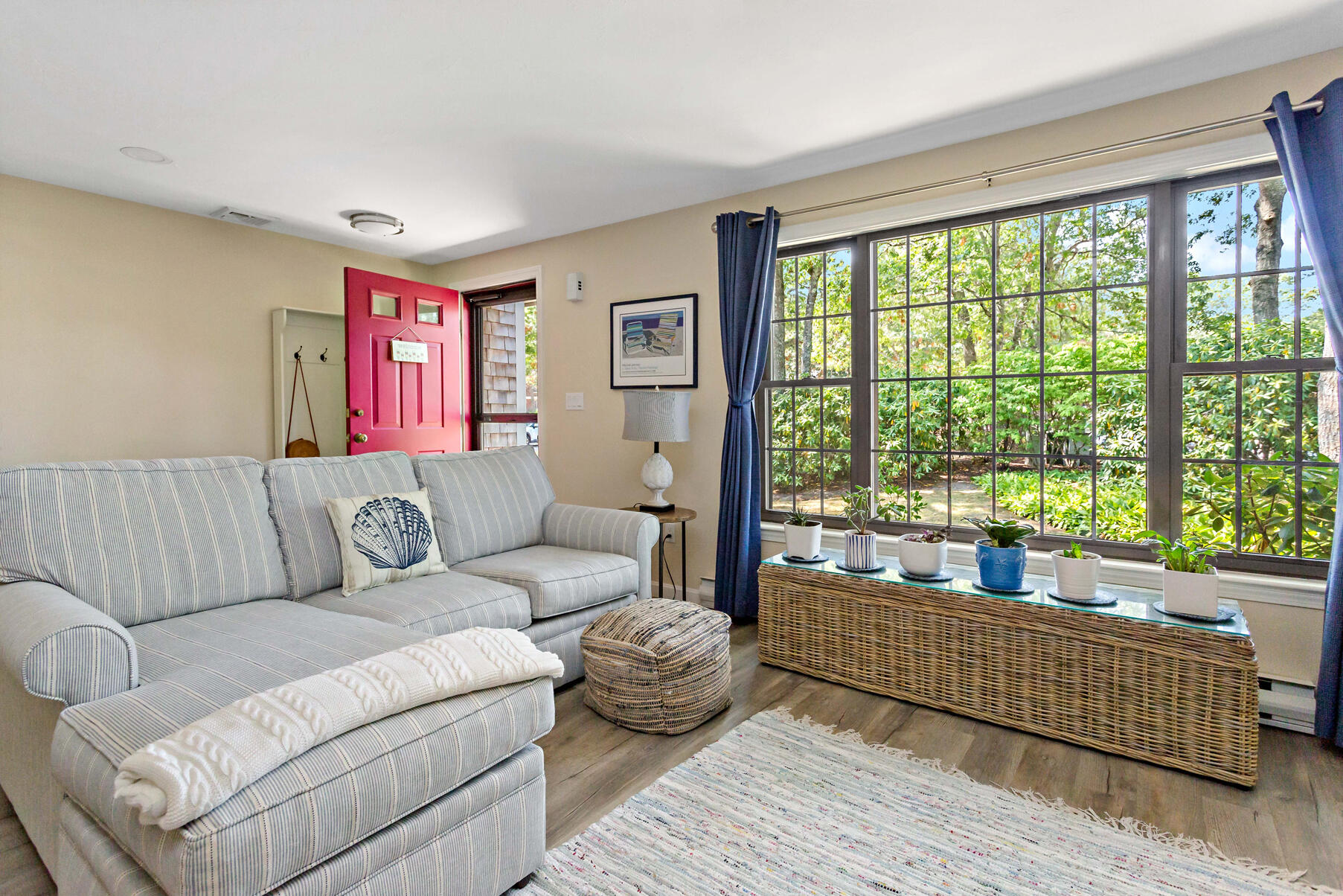 195 Falmouth Road, Unit 16A Mashpee, MA 02649 - Photo 3 of 43 a living room with furniture and a large window
