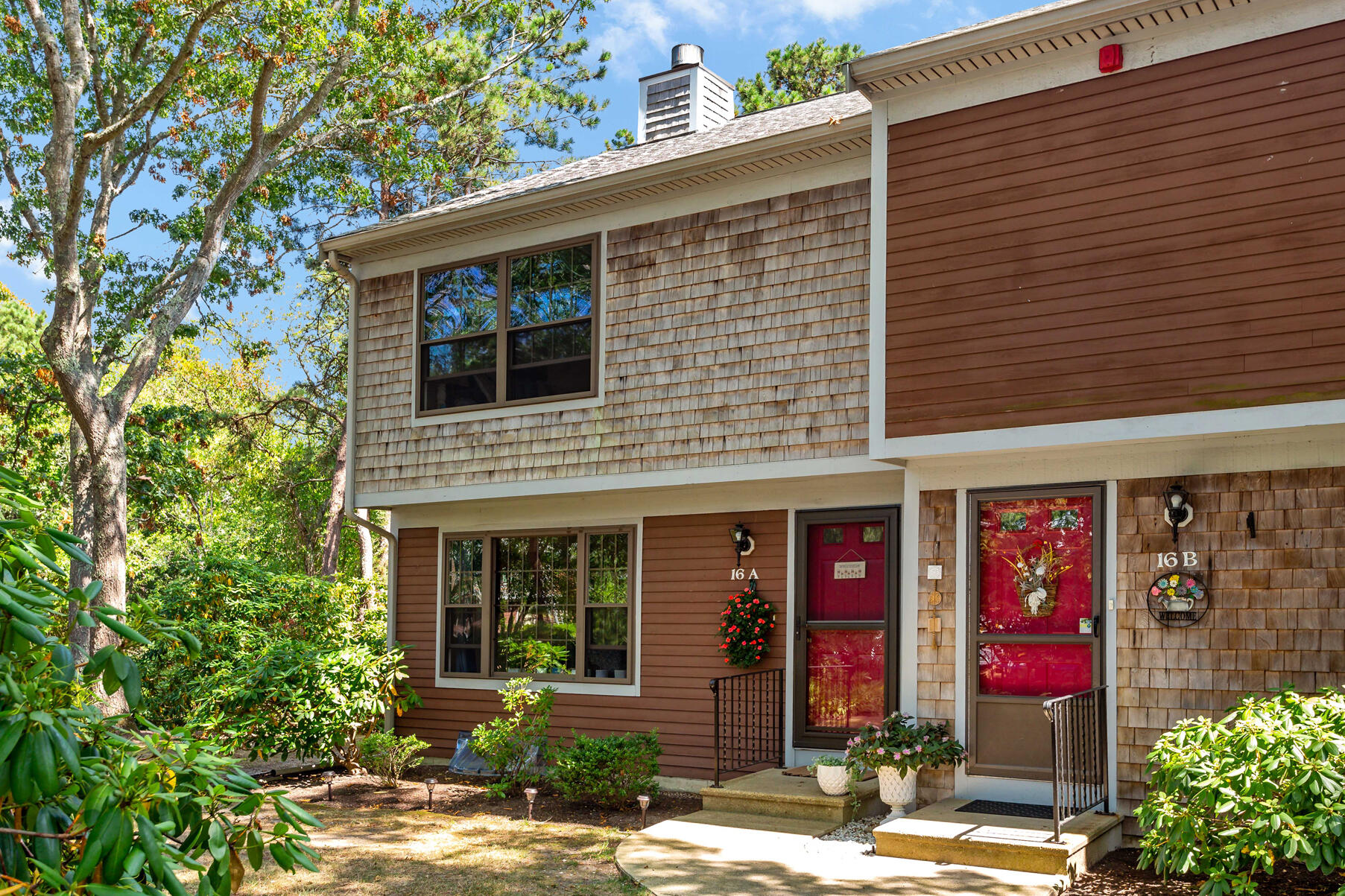 195 Falmouth Road, Unit 16A Mashpee, MA 02649 - Photo 41 of 43 a front view of white house