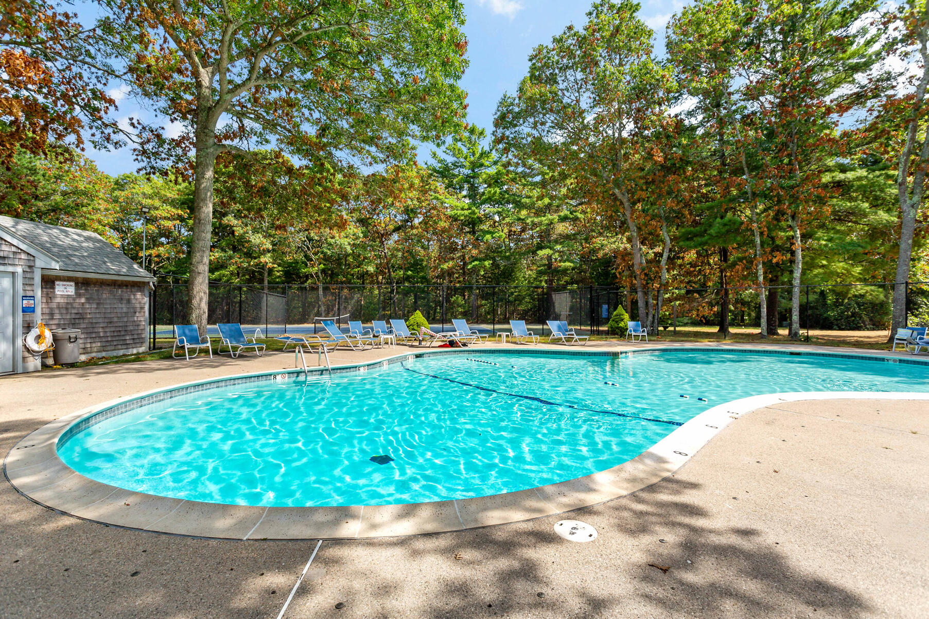 195 Falmouth Road, Unit 16A Mashpee, MA 02649 - Photo 42 of 43 a view of a swimming pool with a patio