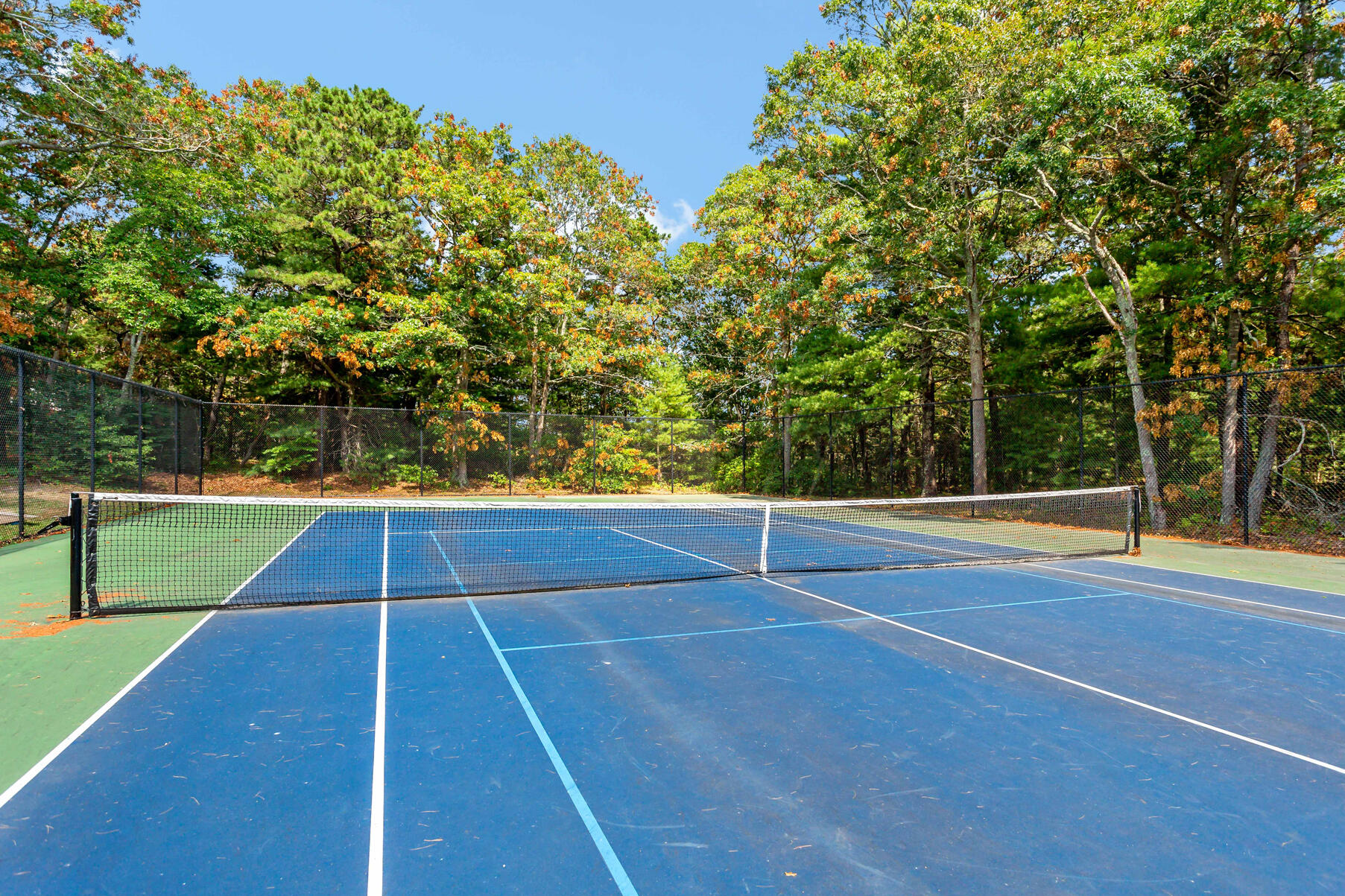 195 Falmouth Road, Unit 16A Mashpee, MA 02649 - Photo 43 of 43 a view of an outdoor space and tennis court