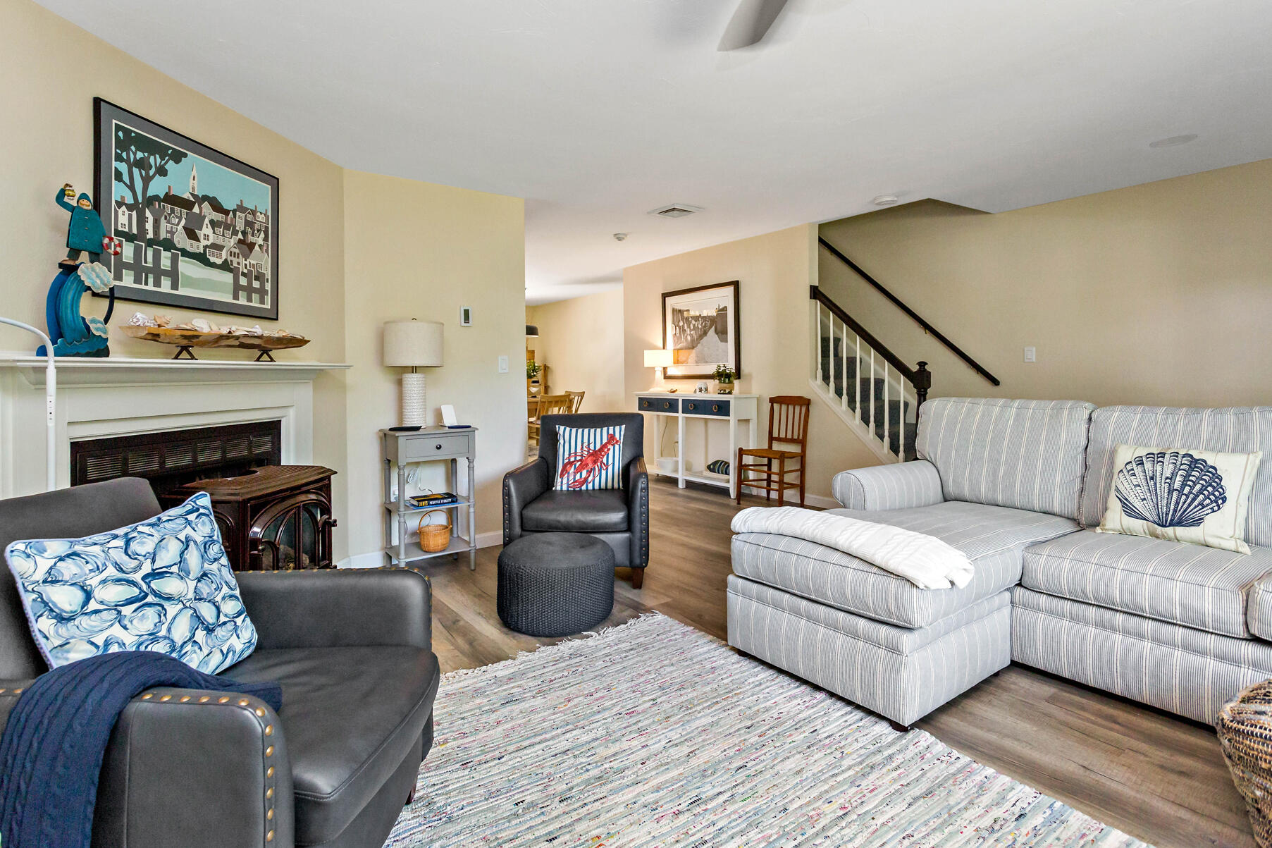 195 Falmouth Road, Unit 16A Mashpee, MA 02649 - Photo 6 of 43 a living room with furniture and a fireplace