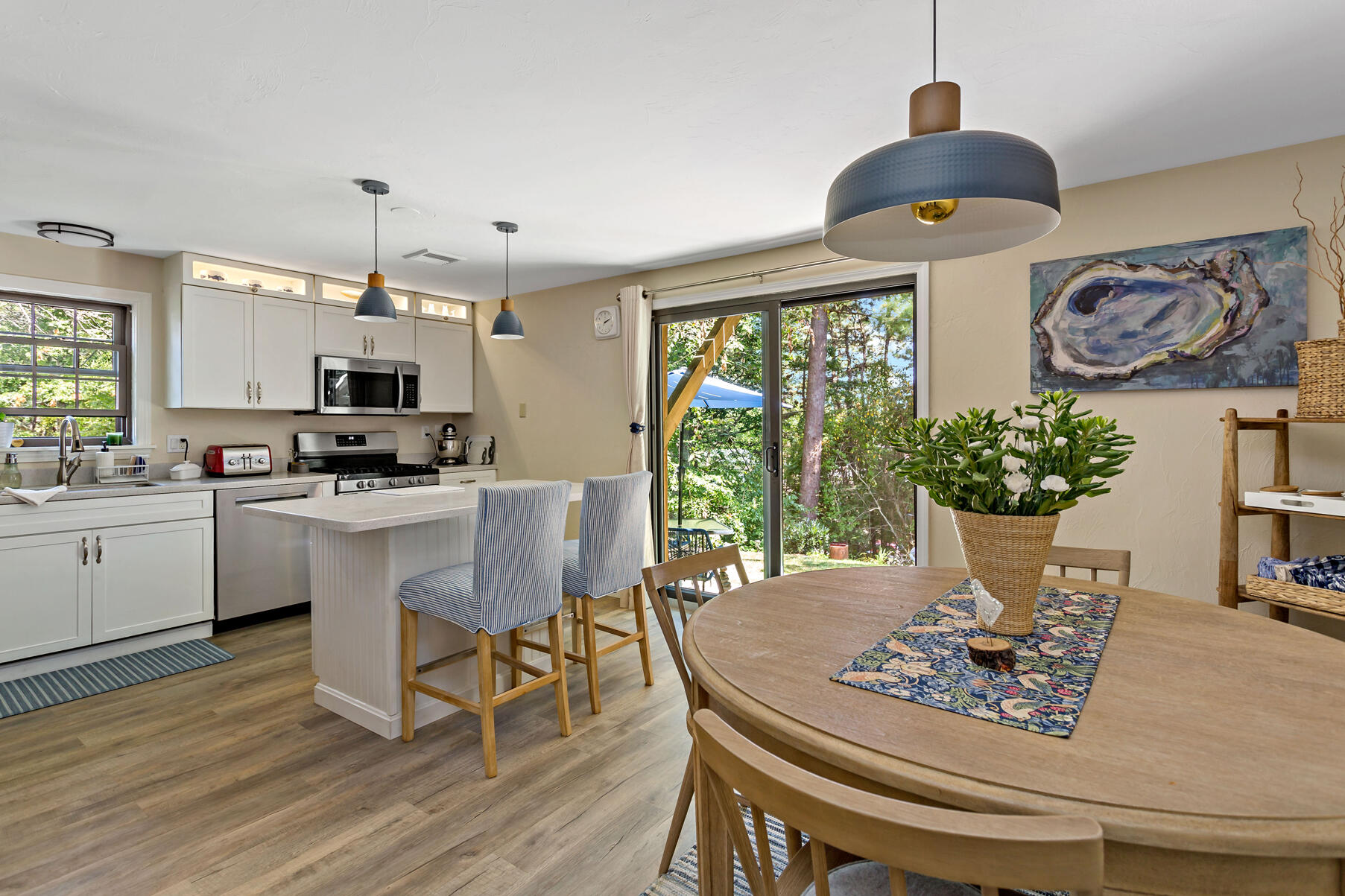 195 Falmouth Road, Unit 16A Mashpee, MA 02649 - Photo 7 of 43 a view of a dining room with furniture window and wooden floor