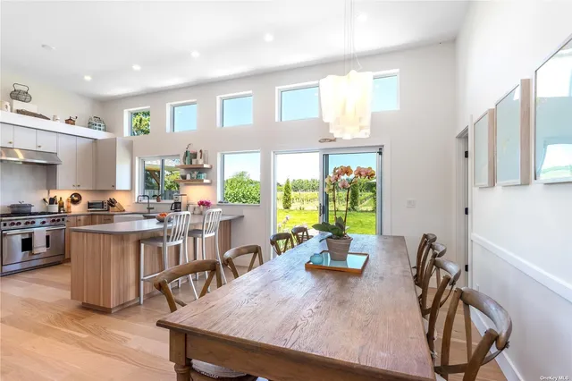 a view of a dining room with furniture window and outside view
