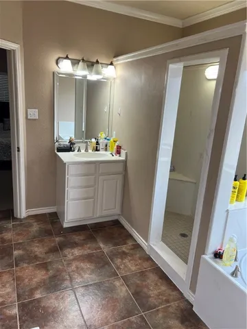 a room with a mirror and shower