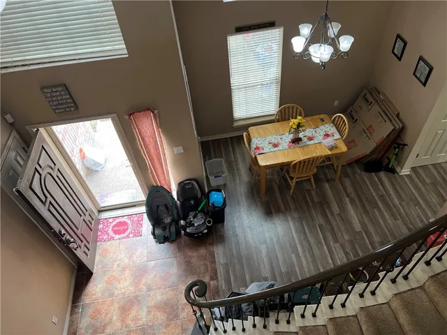 a dining room with furniture and wooden floor