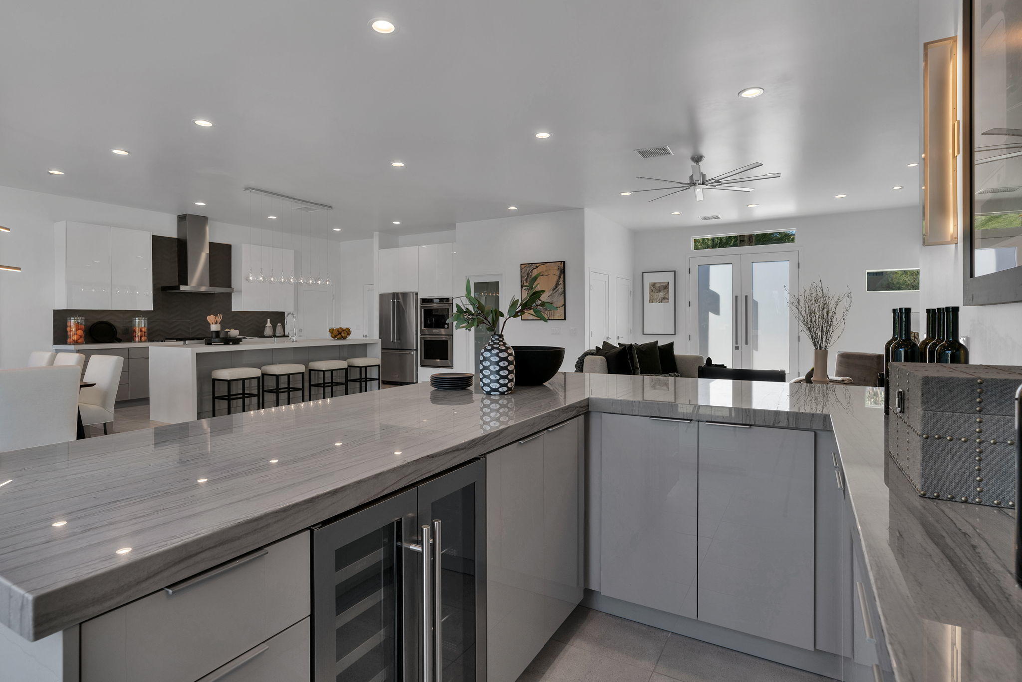 71374 Biskra Road Rancho Mirage, CA 92270 - Photo 15 of 75 a kitchen with stainless steel appliances kitchen island granite countertop a sink and cabinets